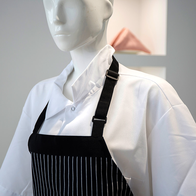 Zwart en wit gestreepte polyester/katoenen nekschort met zakken en verstelbare knoppen